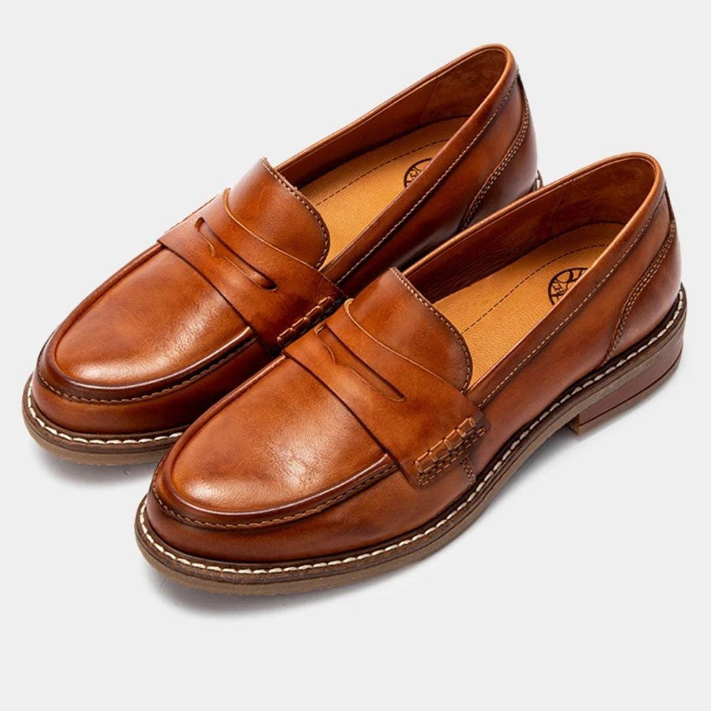 Men's slip-on penny loafers with rounded toes, stitched soles and low flat heels