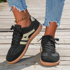 Women's low-top lace-up trainers with panelled side stripes and flat textured soles