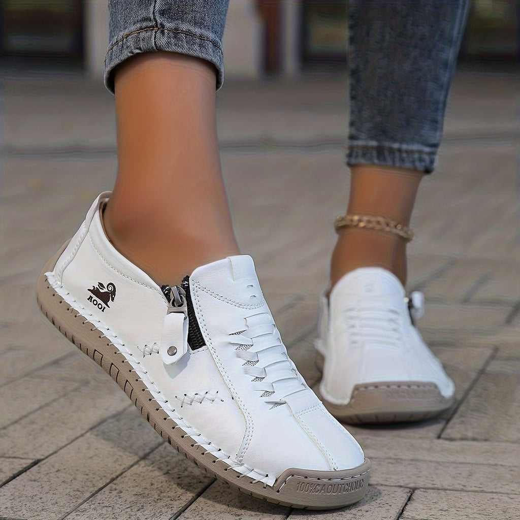 Unisex low-profile lace-up sneakers with side zip and flat textured soles