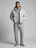 Men's hooded quilted puffer jacket shown in grey and black
