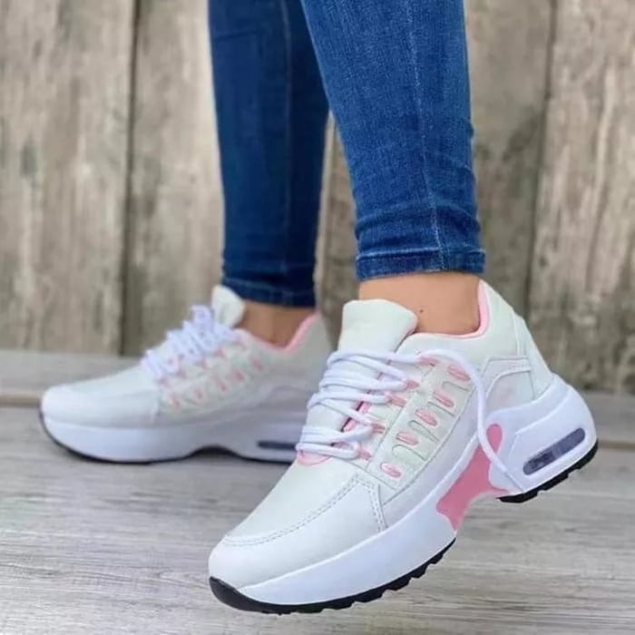 Women's low-top lace-up trainers with textured panels and chunky soles