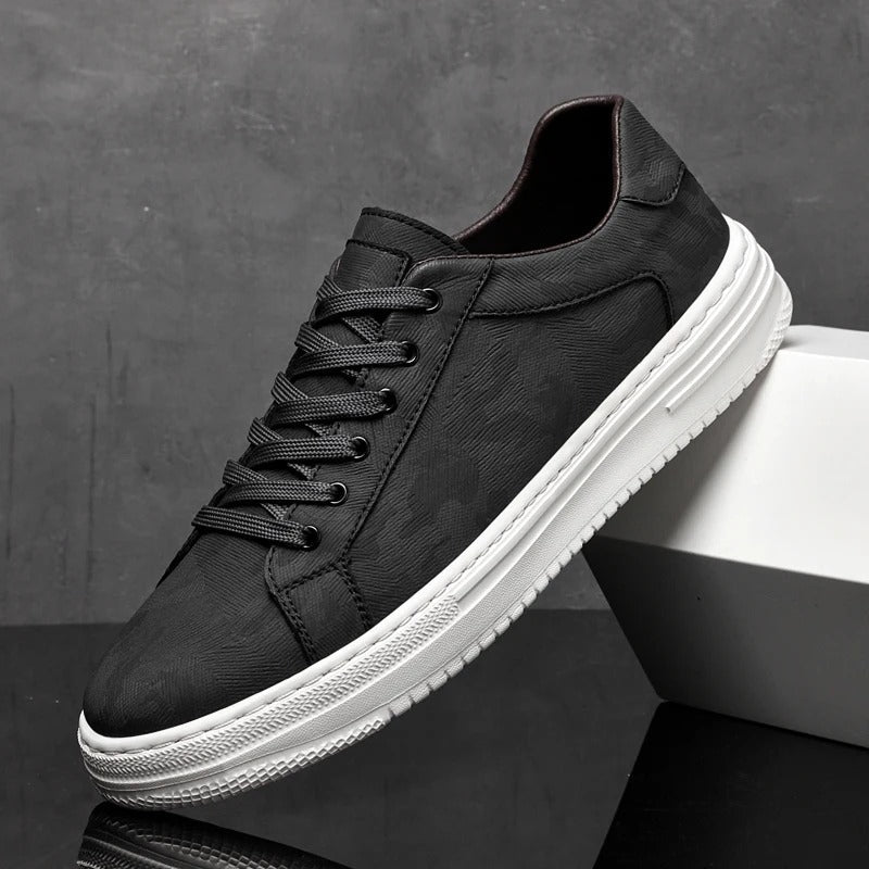 Low-top camouflage trainers with lace-up front and white sole