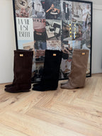Women's dark brown knee-high pointed-toe boots with buckle strap and low heel