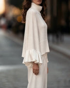 Women's beige roll neck jumper with long sleeves and layered ruffle cuffs
