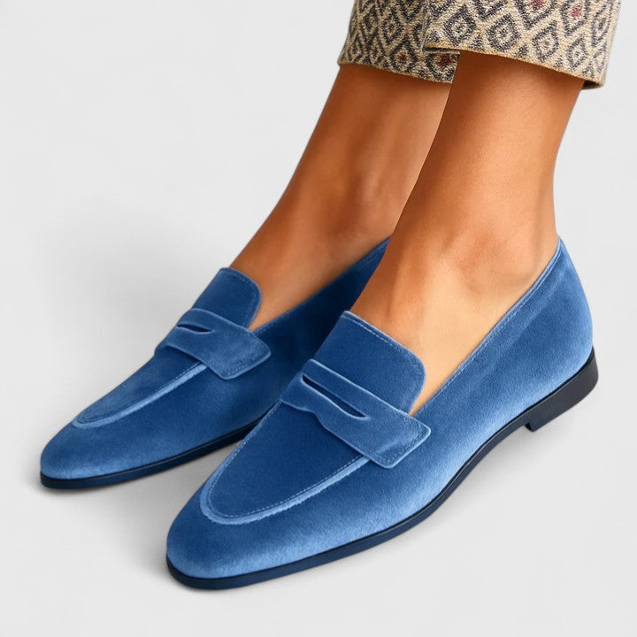 Women's blue square-toe loafers with penny strap detail and flat sole