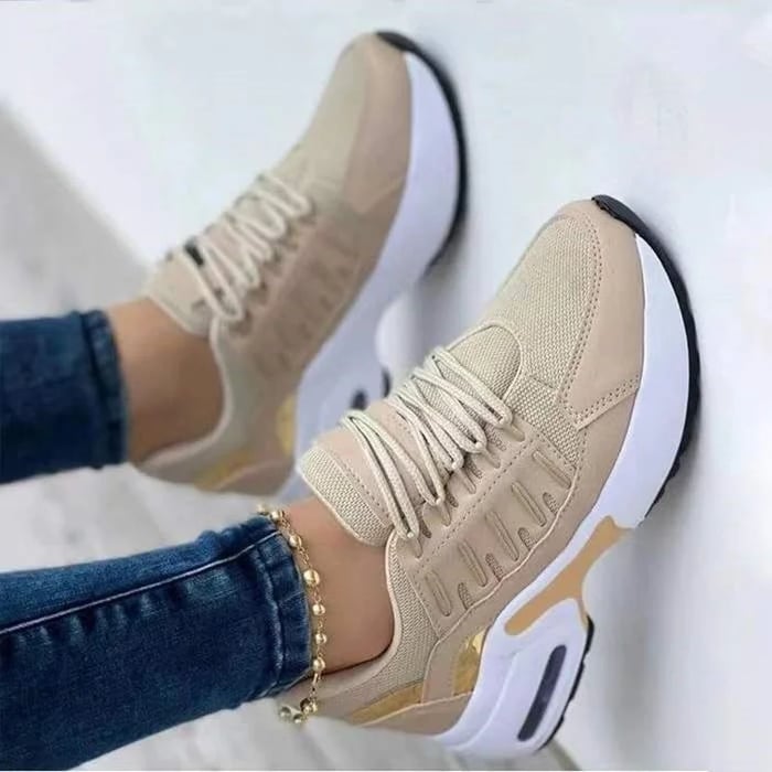 Women's low-top lace-up trainers with textured panels and chunky soles