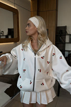 Women's oversized zip hoodie with scattered cherry print and front kangaroo pocket