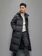 Men's black long hooded puffer coat with quilted panels and front pockets