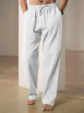 Men's plain straight-leg trousers with an elasticated drawstring waist and side pockets