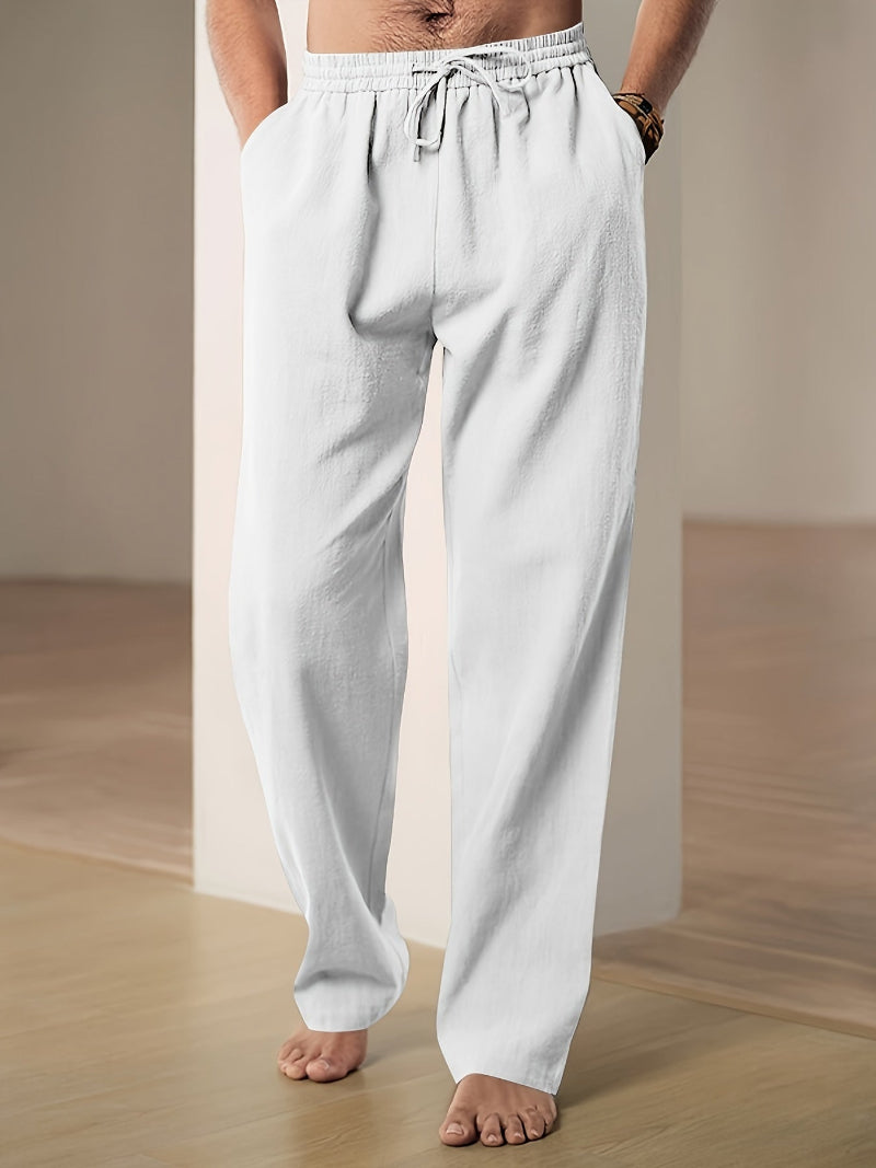 Men's plain straight-leg trousers with an elasticated drawstring waist and side pockets