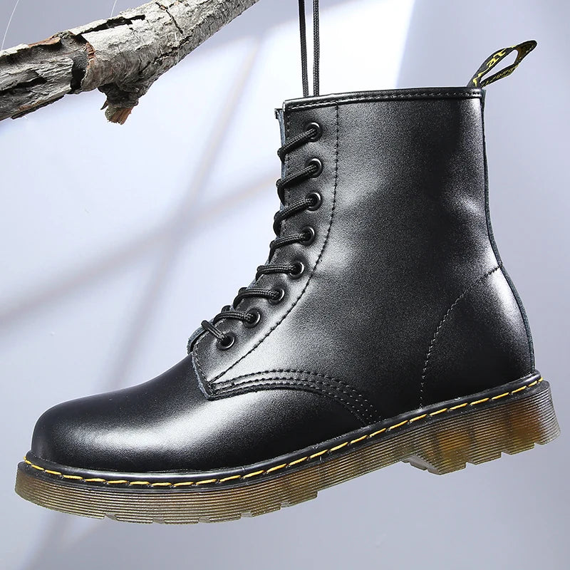 Women's lace-up ankle boots with round toe, flat ridged sole and back pull tab