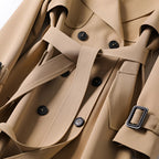 Women's long double-breasted belted trench coat with lapels and cuff buckles