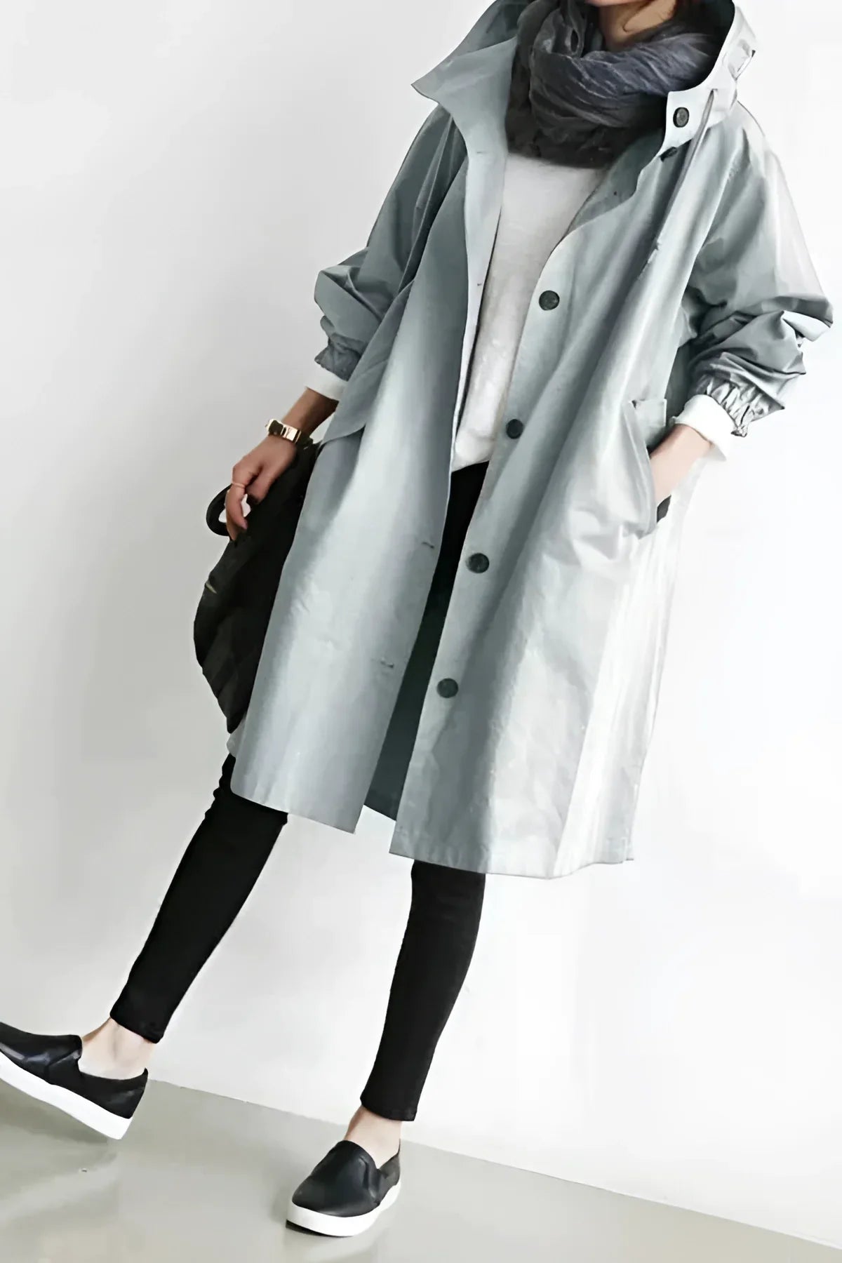 Women's long hooded trench coat with button front and gathered sleeves