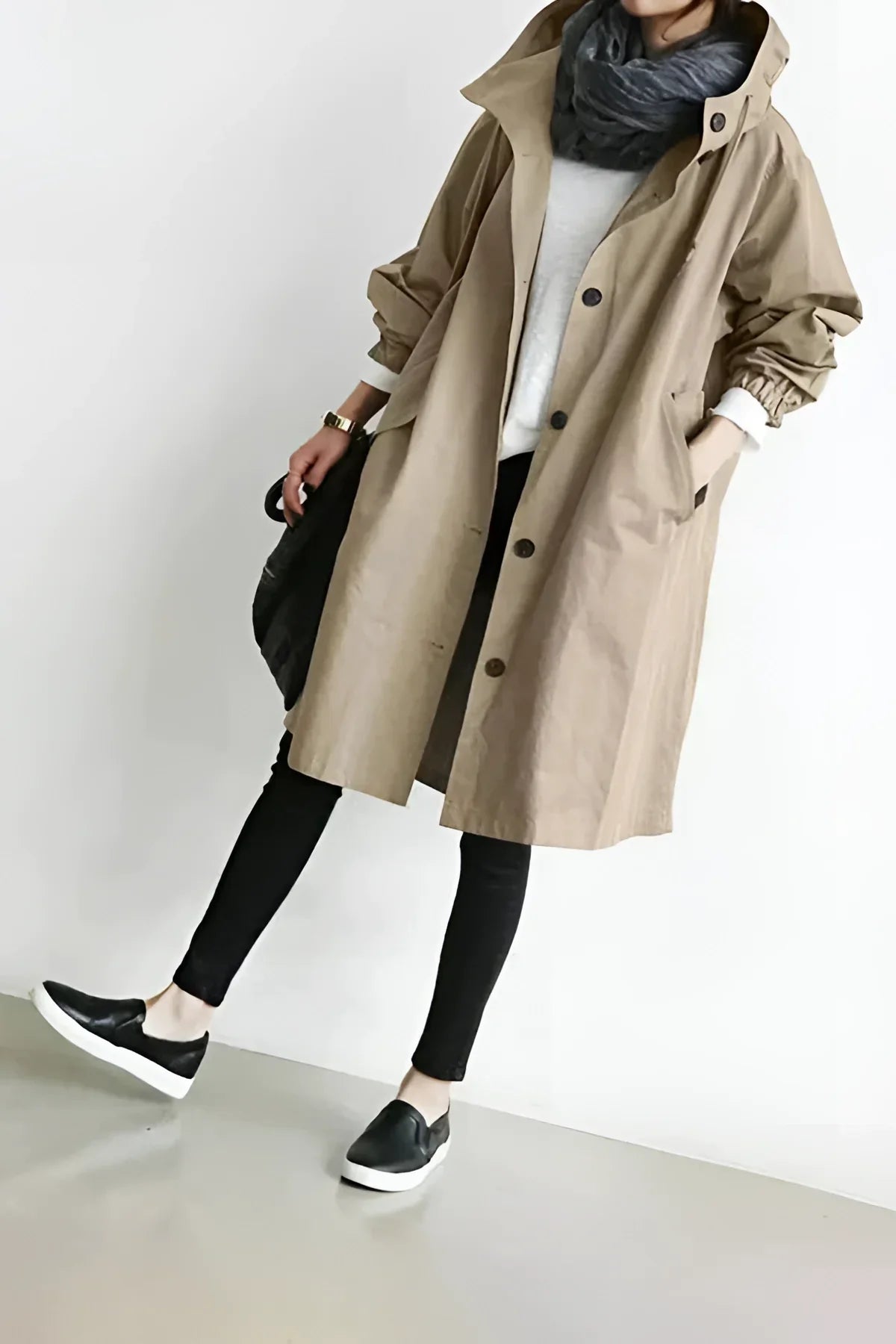 Women's long hooded trench coat with button front and gathered sleeves