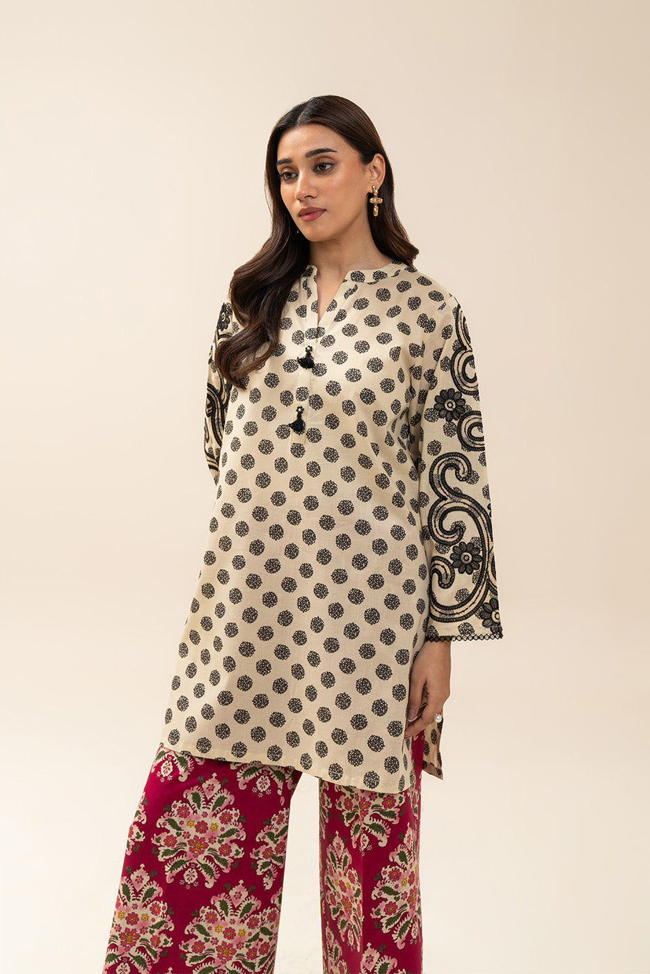 Women's cream and red two-piece printed suit with embroidered tunic and wide trousers