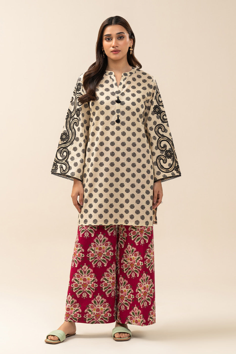 Women's cream and red two-piece printed suit with embroidered tunic and wide trousers