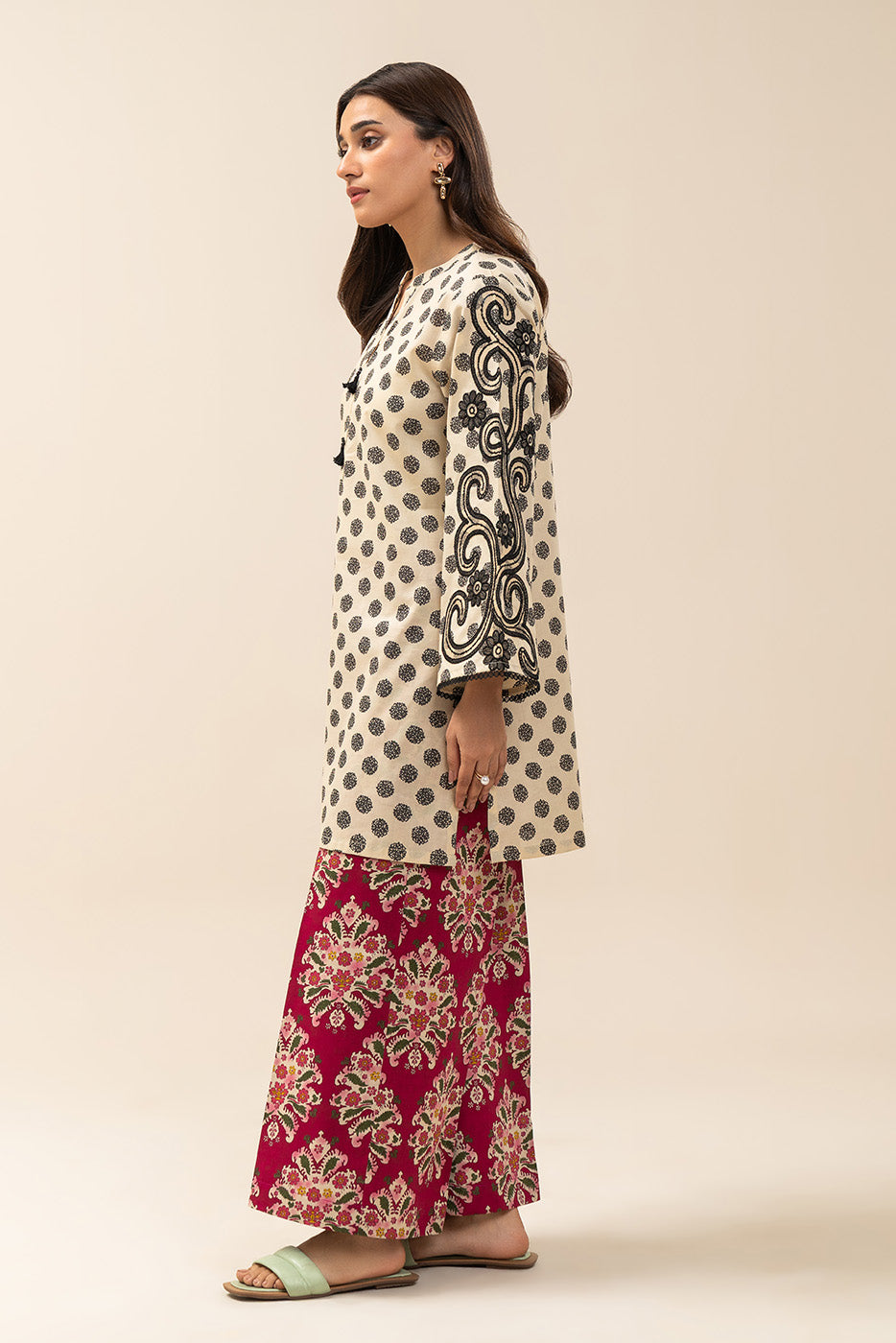 Women's cream and red two-piece printed suit with embroidered tunic and wide trousers