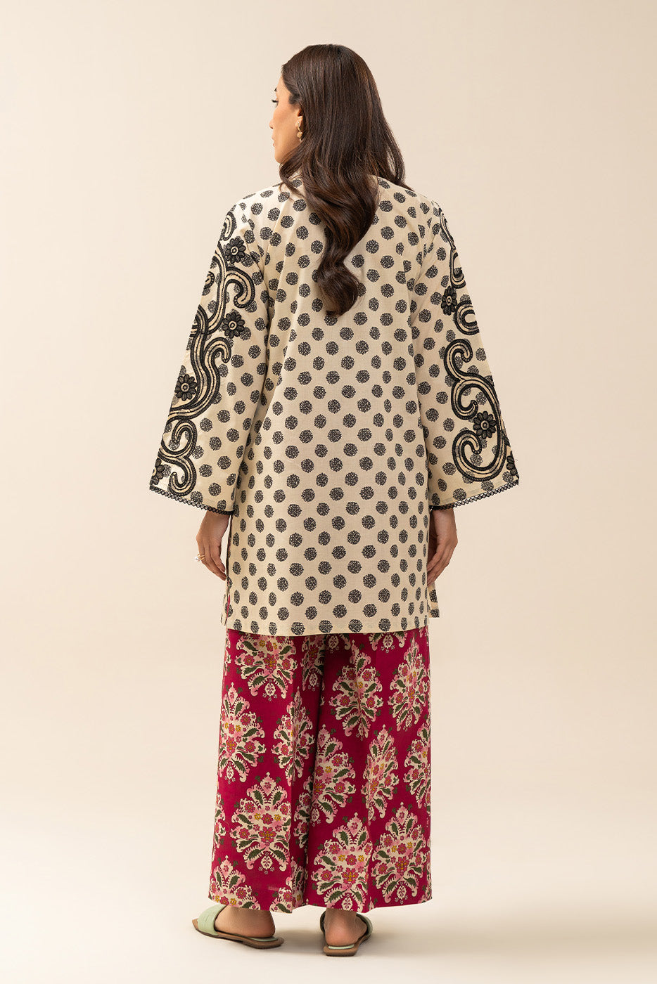 Women's cream and red two-piece printed suit with embroidered tunic and wide trousers
