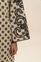 Women's cream and red two-piece printed suit with embroidered tunic and wide trousers