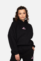 Women's black cropped hoodie with hood and pink chest logo