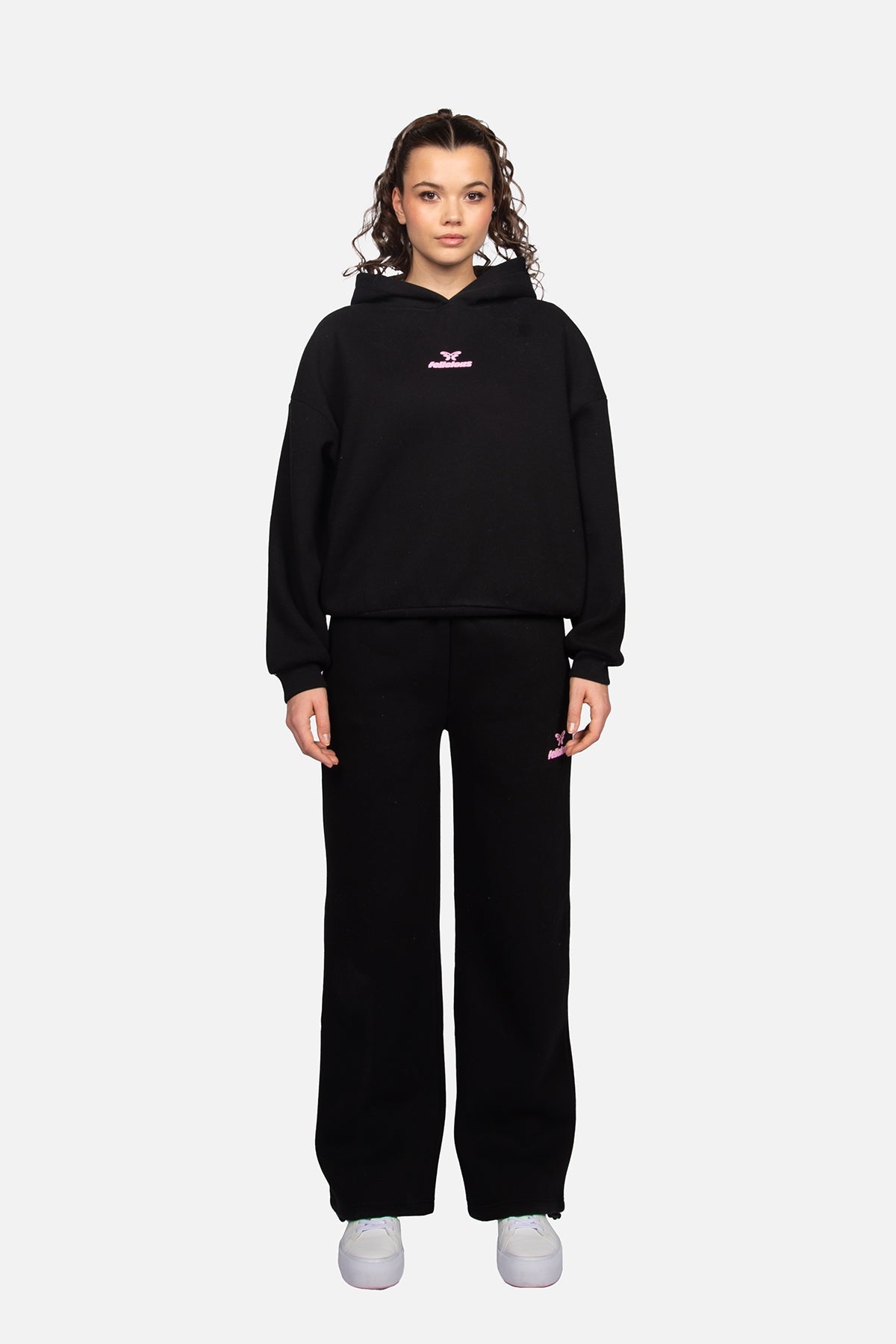 Women's black cropped hoodie with hood and pink chest logo