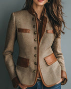 Women's brown herringbone jacket with button front, raised collar and four flap pockets