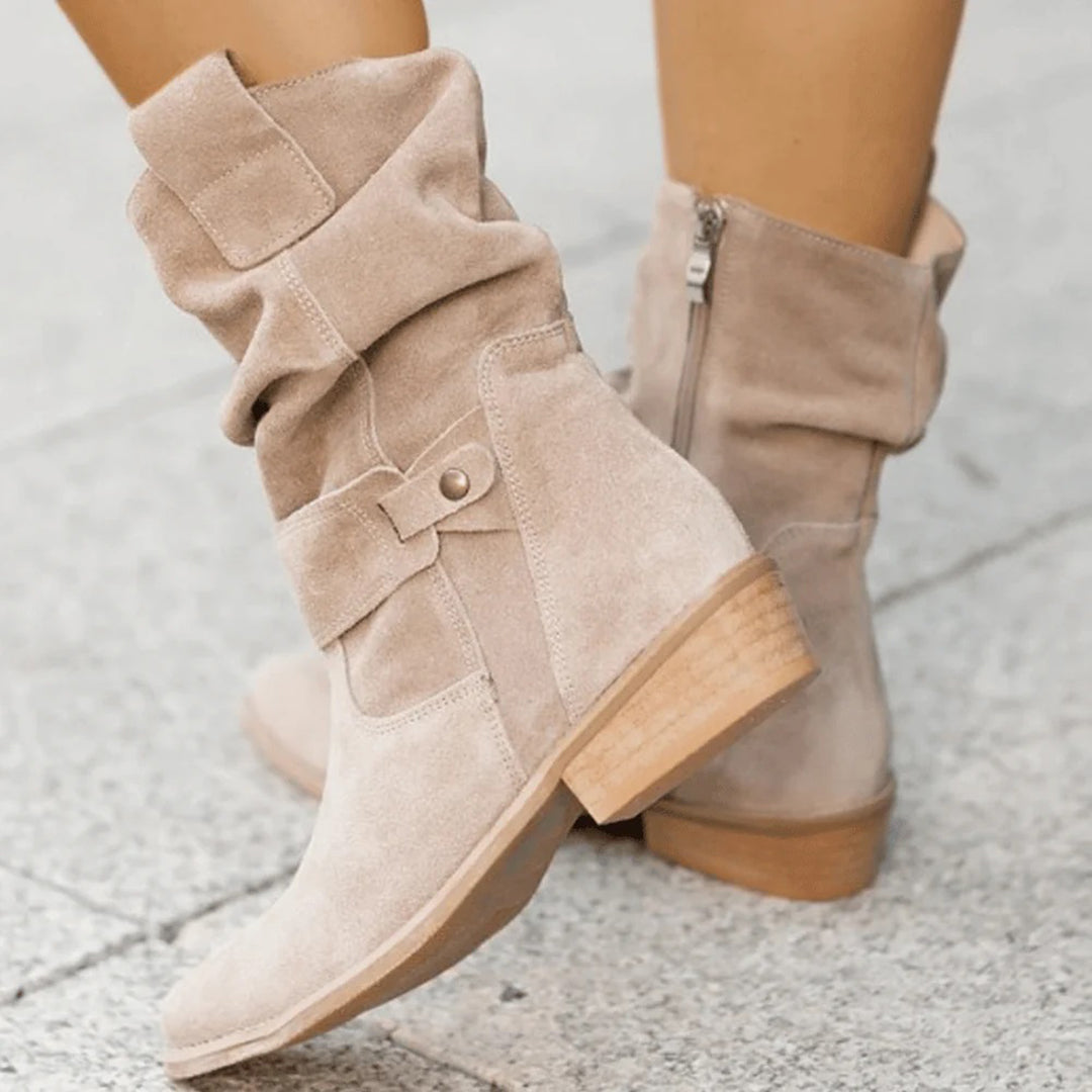 Women's slouch ankle boots with pointed toes, low heels and stitched strap detailing