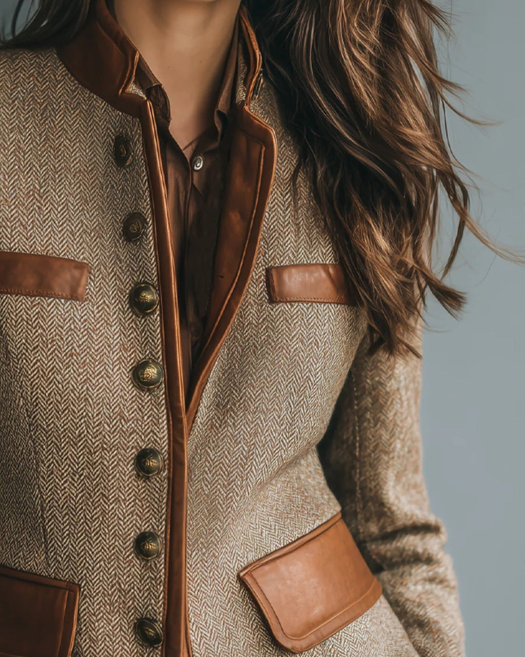 Women's brown herringbone jacket with button front, raised collar and four flap pockets