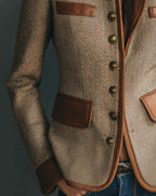 Women's brown herringbone jacket with button front, raised collar and four flap pockets