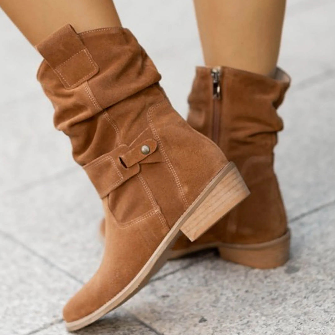 Women's slouch ankle boots with pointed toes, low heels and stitched strap detailing