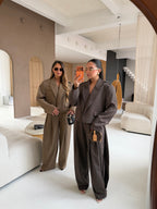 Women's taupe tailored blazer with notch lapels, long sleeves and flap pockets