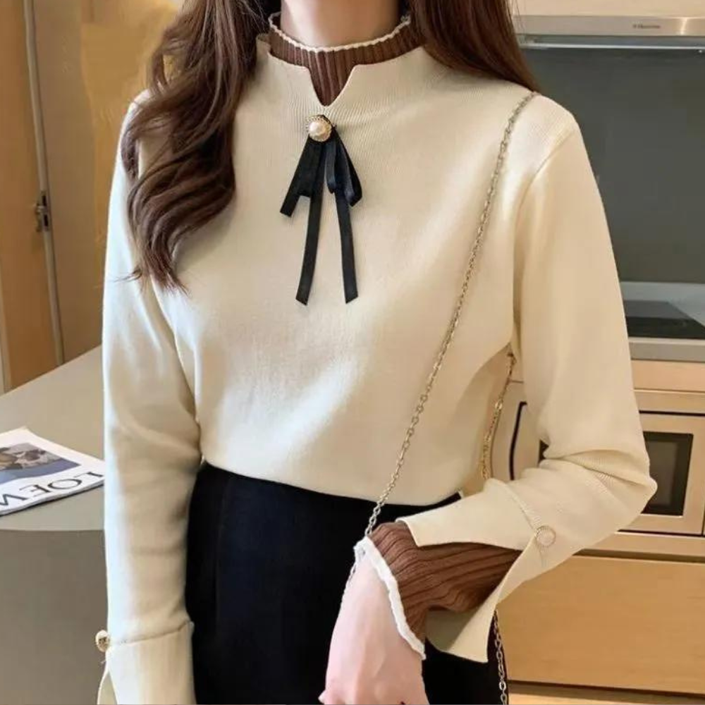 Women's long-sleeved mock neck jumper with pearl button and ribbon bow detail