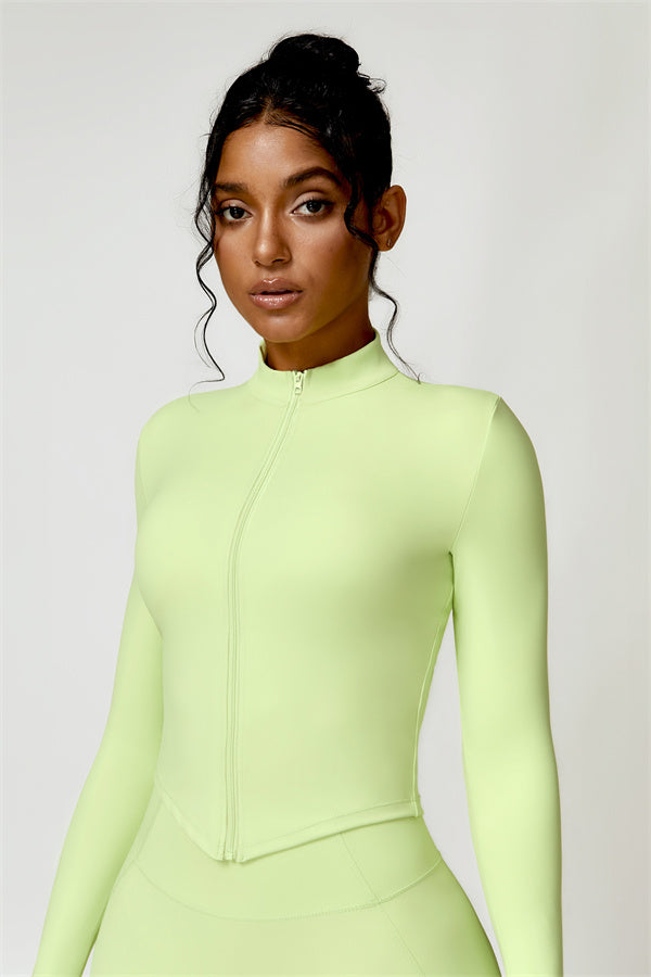 Women's fitted cropped zip jacket with mock neck and long sleeves