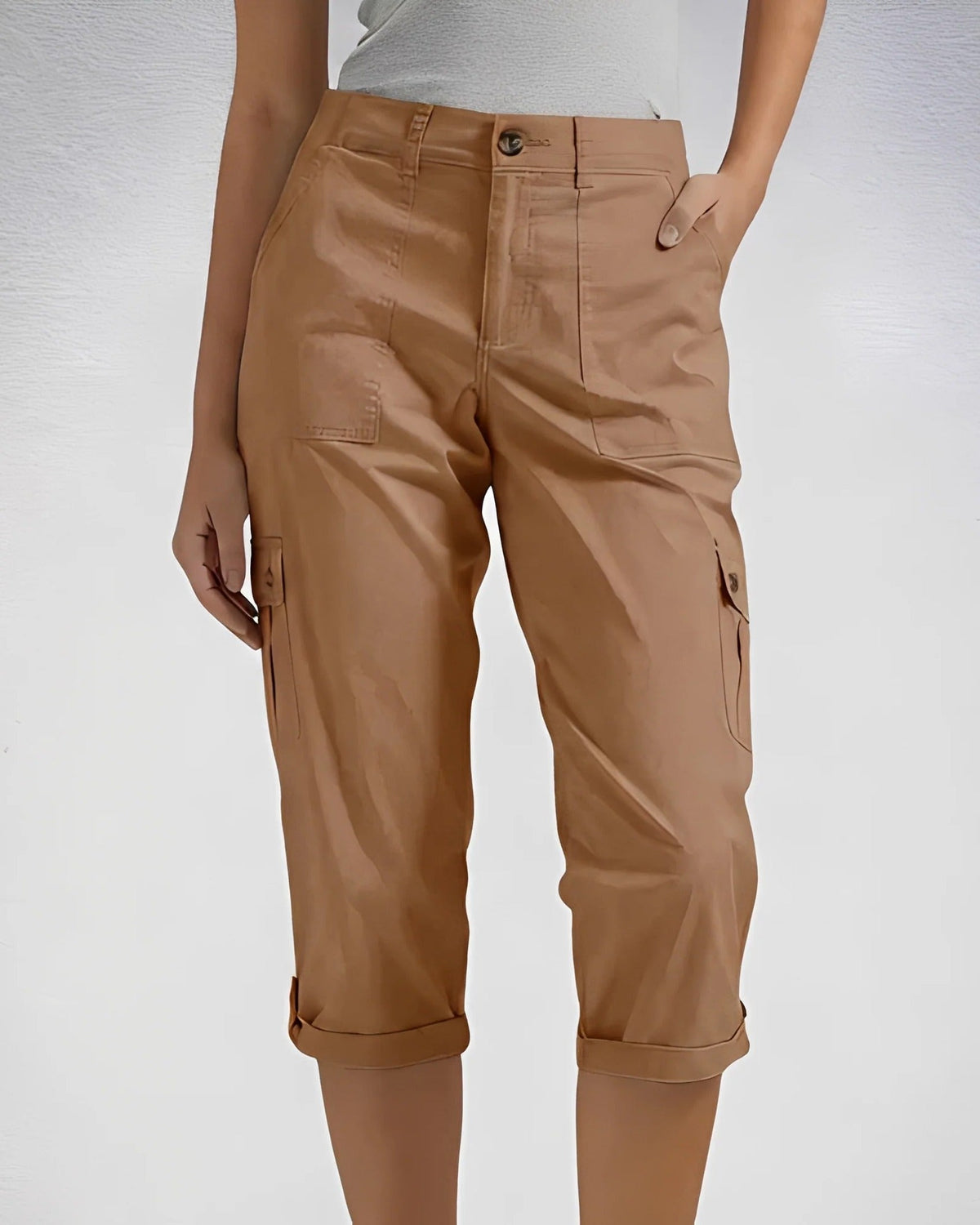 Women's cropped cargo trousers with rolled cuffs and multiple utility pockets