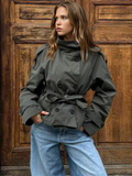 Women's belted double-breasted jacket with high collar and long sleeves
