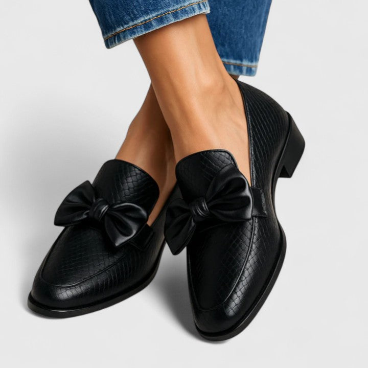 Women's black textured loafers with large bows and low block heels