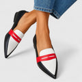Women's white pointed-toe loafers with black edging and red vamp straps