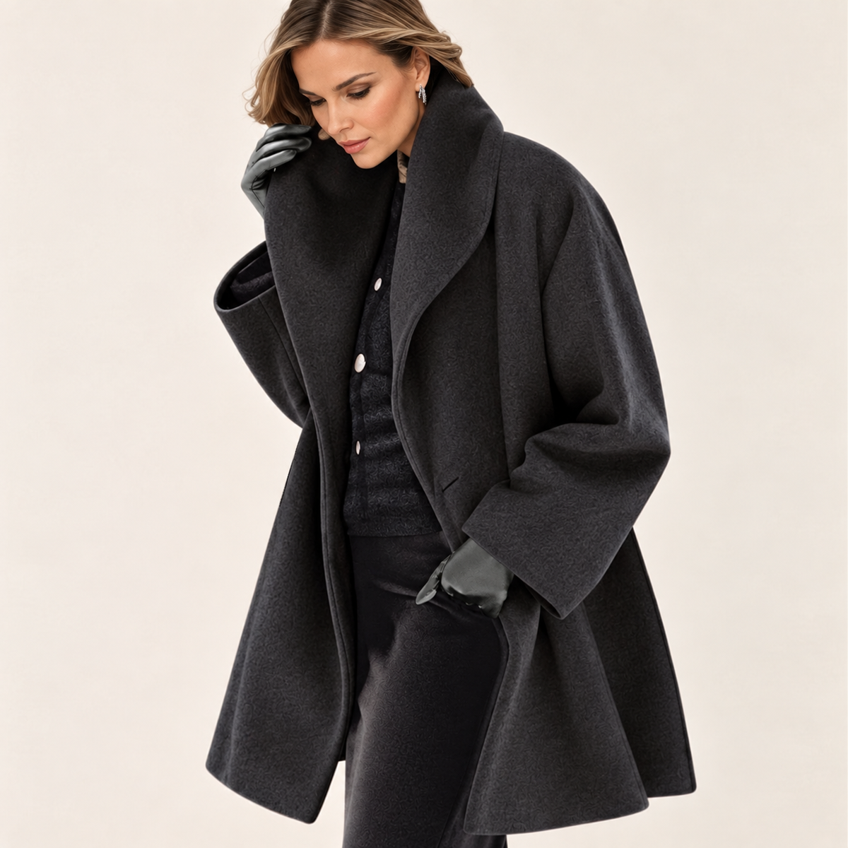Woman wearing a long-sleeved shawl collar tailored jacket with an open front