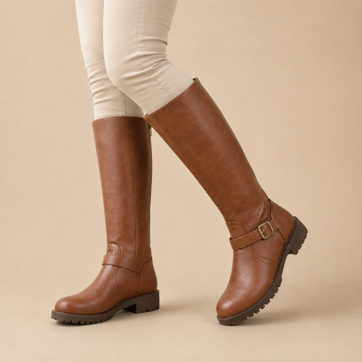 Women's knee high boots with side zips, buckle straps and low block heels