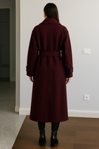 Women's burgundy long belted trench coat with double-breasted buttons and lapels