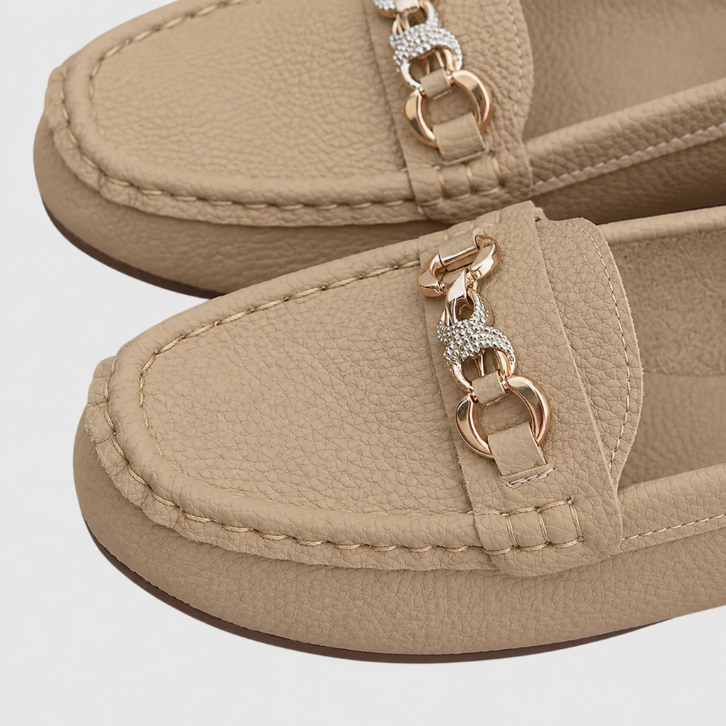 Women's slip-on loafers with rounded toes and decorative chain detail