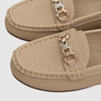 Women's slip-on loafers with rounded toes and decorative chain detail