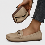 Women's slip-on loafers with rounded toes and decorative chain detail