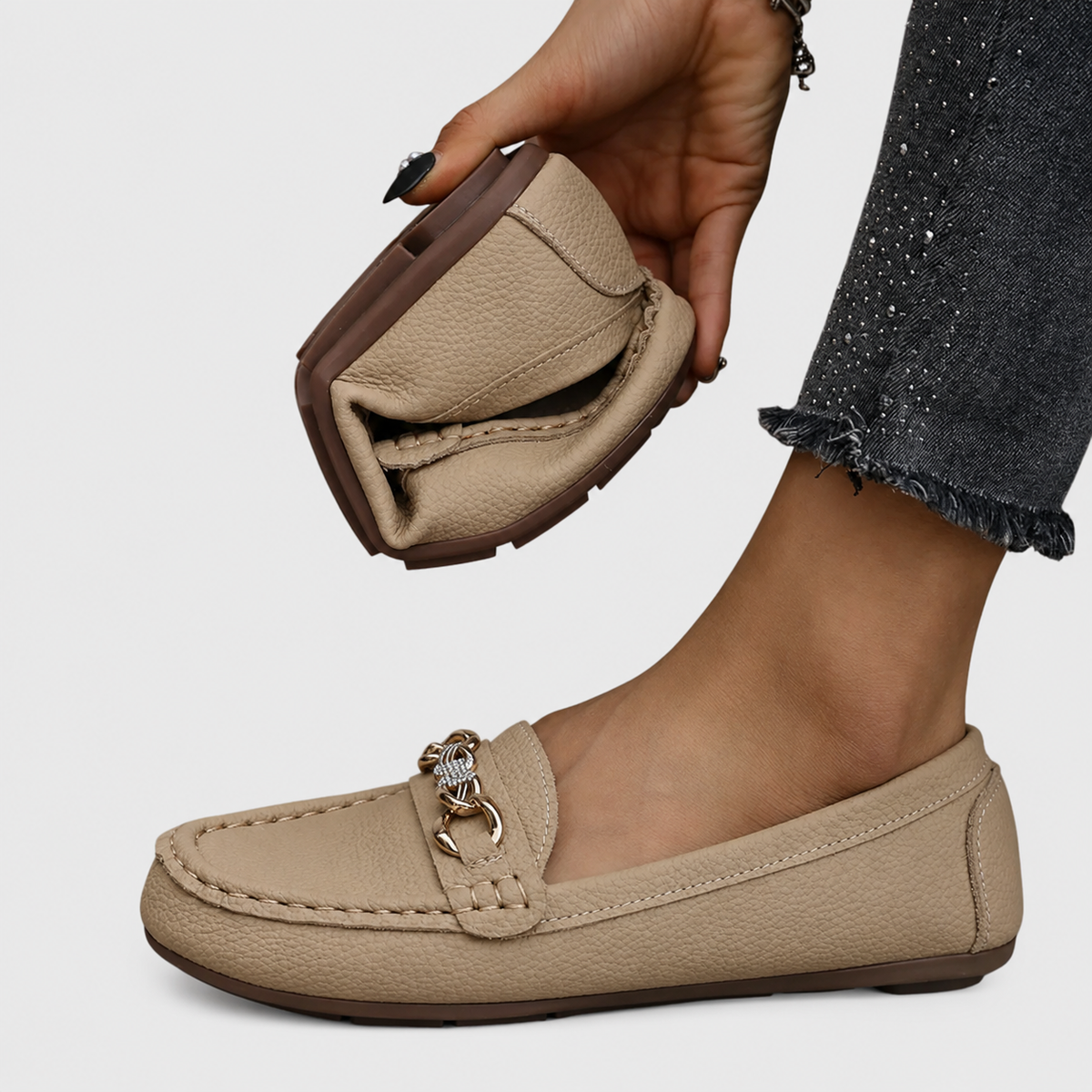 Women's slip-on loafers with rounded toes and decorative chain detail