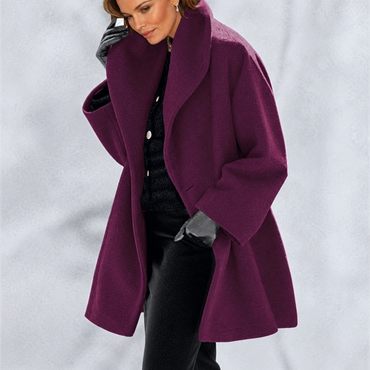 Woman wearing a long-sleeved shawl collar tailored jacket with an open front