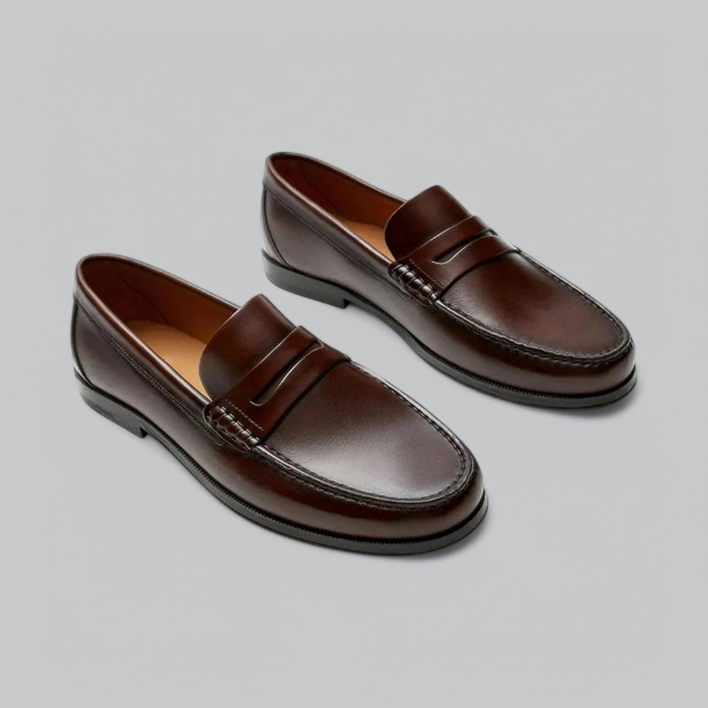 Men's polished penny strap loafers with rounded toes and low heels