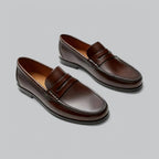 Men's polished penny strap loafers with rounded toes and low heels