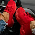 Women's lace-up walking sneakers with textured uppers and ridged flat soles