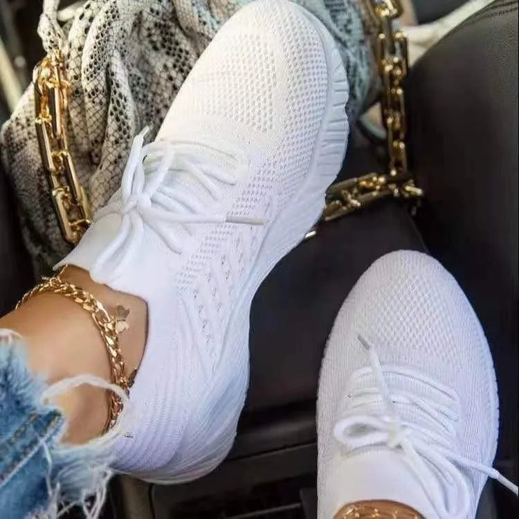Women's lace-up walking sneakers with textured uppers and ridged flat soles