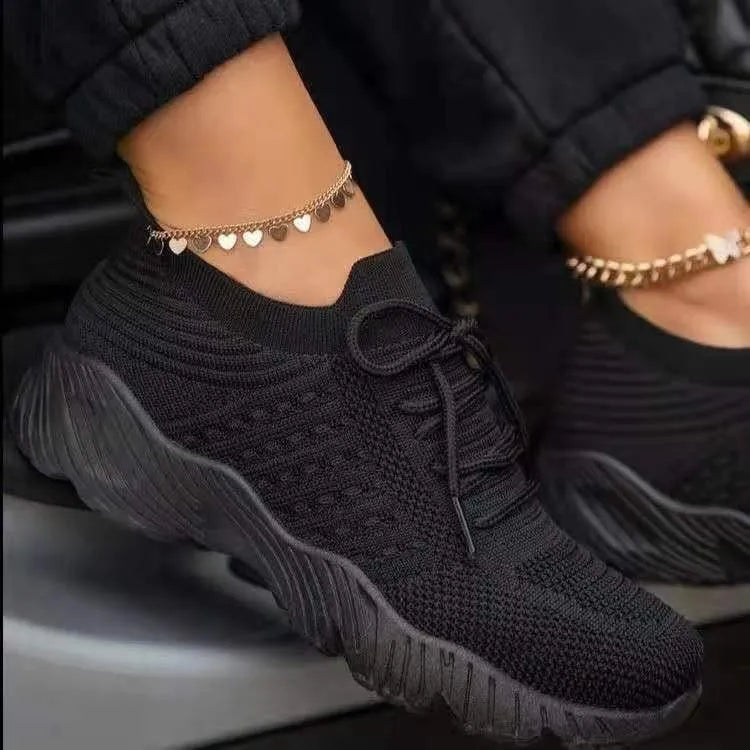 Women's lace-up walking sneakers with textured uppers and ridged flat soles